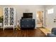 Cozy living room with stylish blue dresser and a glimpse into the adjacent bedroom at 117 Franklin St, Clover, SC 29710