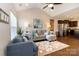 Inviting living room with vaulted ceilings, comfortable seating, and an open layout to the kitchen at 117 Franklin St, Clover, SC 29710