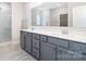 Stylish bathroom features double sink vanity, walk-in shower, and modern finishes at 12140 Mcdowell Pl, Huntersville, NC 28078