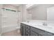 Bright bathroom features a double vanity and tub with shower combination at 12140 Mcdowell Pl, Huntersville, NC 28078