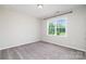 Bright, spacious bedroom with large window letting in plenty of natural light at 12140 Mcdowell Pl, Huntersville, NC 28078