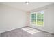 Bright bedroom filled with natural light from the large window overlooking the backyard at 12140 Mcdowell Pl, Huntersville, NC 28078