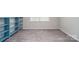 Cozy bedroom featuring a large window, closet, and neutral decor at 12140 Mcdowell Pl, Huntersville, NC 28078