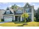 Charming two-story home with a large front yard and attached two car garage at 12140 Mcdowell Pl, Huntersville, NC 28078