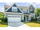 Beautiful home featuring a two-car garage, well-kept lawn, and inviting curb appeal at 12140 Mcdowell Pl, Huntersville, NC 28078