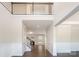 Bright foyer with high ceilings, beautiful wainscoting, hardwood floors, and staircase at 12140 Mcdowell Pl, Huntersville, NC 28078