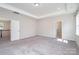 Spacious main bedroom with tray ceiling, lots of light, and ensuite bathroom at 12140 Mcdowell Pl, Huntersville, NC 28078