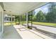 Relax on this screened porch with scenic views of the backyard and landscaping at 12140 Mcdowell Pl, Huntersville, NC 28078