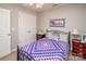 Comfortable bedroom boasts a black metal bed frame, soft pillows, and a view of the closet at 1304 Hammond Dr, Matthews, NC 28104