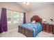 Inviting bedroom with vaulted ceiling, large windows, and ample natural light at 1304 Hammond Dr, Matthews, NC 28104