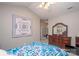 Cozy bedroom featuring ceiling fan, quilt, and dark wood dresser at 1304 Hammond Dr, Matthews, NC 28104