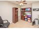 Spacious bonus room with ceiling fan, bookcases, and neutral carpeting at 1304 Hammond Dr, Matthews, NC 28104