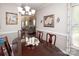 Inviting dining area with a view into the living room, creating an open and connected living space at 1304 Hammond Dr, Matthews, NC 28104