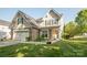 Charming home with stone accents, well-maintained lawn, and inviting front porch with seating at 1304 Hammond Dr, Matthews, NC 28104