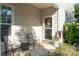 Cozy front porch featuring comfortable seating, decorative plants, and a welcoming entrance at 1304 Hammond Dr, Matthews, NC 28104