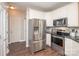 Bright kitchen featuring stainless steel appliances, white cabinetry and granite countertops at 1304 Hammond Dr, Matthews, NC 28104