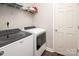 Practical laundry room with modern washer, dryer, and overhead storage shelf at 1304 Hammond Dr, Matthews, NC 28104