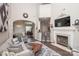 Inviting living area with fireplace, comfortable seating, and bar, perfect for entertaining guests at 1304 Hammond Dr, Matthews, NC 28104