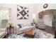 Bright living room with high ceilings, large windows, and modern decor, offering a comfortable living space at 1304 Hammond Dr, Matthews, NC 28104