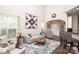 Open living room with high ceilings, modern furniture, hardwood floors, and plenty of natural light at 1304 Hammond Dr, Matthews, NC 28104