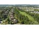 An aerial view showcases the property alongside a golf course and neighborhood streets at 16522 Flintrock Falls Ln, Charlotte, NC 28278