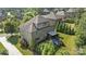 An aerial view of the home showcases its backyard patio, landscaping, and surrounding neighborhood at 16522 Flintrock Falls Ln, Charlotte, NC 28278