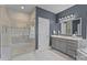 Modern bathroom featuring a glass-enclosed shower, sleek vanity, and elegant fixtures at 16522 Flintrock Falls Ln, Charlotte, NC 28278
