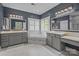 Elegant bathroom with a soaking tub, dual vanities, marble countertops, and stylish fixtures at 16522 Flintrock Falls Ln, Charlotte, NC 28278