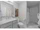 Bright bathroom with a single vanity, framed mirror, and shower/tub combo at 16522 Flintrock Falls Ln, Charlotte, NC 28278