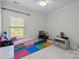 Bright bedroom with a large window and playful decor with an organized play area at 16522 Flintrock Falls Ln, Charlotte, NC 28278