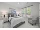 Comfortable bedroom with soft natural light, plush bed, and a relaxing atmosphere at 16522 Flintrock Falls Ln, Charlotte, NC 28278