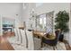 Bright dining room features high ceilings and a large table with comfortable seating at 16522 Flintrock Falls Ln, Charlotte, NC 28278