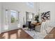 Bright dining room with hardwood floors and a view of the outdoors at 16522 Flintrock Falls Ln, Charlotte, NC 28278