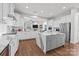 Spacious, all-white kitchen with a central island and modern appliances at 16522 Flintrock Falls Ln, Charlotte, NC 28278