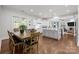 The kitchen features a center island with white cabinets and stainless steel appliances at 16522 Flintrock Falls Ln, Charlotte, NC 28278