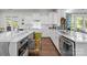 Bright kitchen features stainless steel appliances, white subway tile backsplash, and a marble counter at 16522 Flintrock Falls Ln, Charlotte, NC 28278