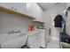 Well-organized laundry room with modern appliances, ample cabinet space, and a functional design at 16522 Flintrock Falls Ln, Charlotte, NC 28278