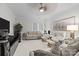 Spacious living room with plush seating, modern lighting, and contemporary decor at 16522 Flintrock Falls Ln, Charlotte, NC 28278