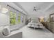 A spacious primary bedroom filled with natural light, featuring a tray ceiling and neutral decor at 16522 Flintrock Falls Ln, Charlotte, NC 28278