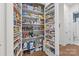 Walk-in pantry with organized shelves, filled with food and beverages at 16522 Flintrock Falls Ln, Charlotte, NC 28278