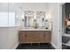 Bathroom featuring double vanity with marble countertop, modern mirrors, and sleek fixtures at 17711 North Shore Cir, Cornelius, NC 28031