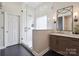 Bathroom showcasing glass shower, white subway tiles, dark accents, and a marble-topped vanity at 17711 North Shore Cir, Cornelius, NC 28031