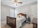 Bedroom showcasing neutral walls, carpet, and a wood-framed bed with a cozy, inviting atmosphere at 17711 North Shore Cir, Cornelius, NC 28031