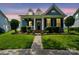 Charming two-story home with a manicured lawn, inviting entryway, and flowering plants at 17711 North Shore Cir, Cornelius, NC 28031