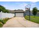 Detached two car garage with a basketball hoop and a long driveway at 17711 North Shore Cir, Cornelius, NC 28031