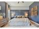 Relaxing main bedroom with soft carpet, decorative lamps, and modern accents at 17711 North Shore Cir, Cornelius, NC 28031