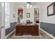 Classic home office featuring a large wooden desk, built-in shelving, and refined decor at 17711 North Shore Cir, Cornelius, NC 28031