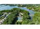 Aerial view of lakeside community amenities including tennis and sports courts and pool, with ample parking areas at 18439 Victoria Bay Dr, Cornelius, NC 28031