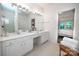 Bright bathroom with double vanity and plenty of counter space at 18439 Victoria Bay Dr, Cornelius, NC 28031