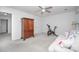 Bonus room features an exercise bike, sofa, ceiling fan, and natural light at 18439 Victoria Bay Dr, Cornelius, NC 28031